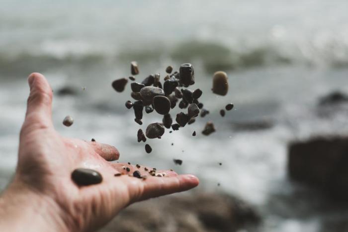 Romeo is throwing pebbles gently